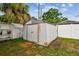 This is a rusted shed with a metal door in the back yard at 2818 Lorraine St, Tampa, FL 33614