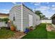 Backyard storage building with artificial turf and landscaping at 2818 Lorraine St, Tampa, FL 33614
