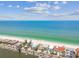Stunning aerial view showcasing beachfront property with turquoise ocean and white sandy beach at 30 Gulf Blvd, Indian Rocks Beach, FL 33785