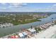 An aerial view showcasing a beachfront property, beautiful water views, and clear blue skies on a sunny day at 30 Gulf Blvd, Indian Rocks Beach, FL 33785