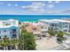 Panoramic aerial view of the house, situated next to the beach and other buildings at 30 Gulf Blvd, Indian Rocks Beach, FL 33785