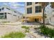 Backyard includes a sandy area with ample room for outdoor activities and landscaping at 30 Gulf Blvd, Indian Rocks Beach, FL 33785