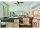 Well-lit bar area with built-in shelves, bar seating, and classic tile flooring at 30 Gulf Blvd, Indian Rocks Beach, FL 33785