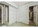 Spacious basement area with a storage closet and access to utility systems, waiting for renovation at 30 Gulf Blvd, Indian Rocks Beach, FL 33785
