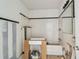 Bathroom undergoing renovations with tiled walls and an exposed bathtub at 30 Gulf Blvd, Indian Rocks Beach, FL 33785