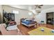 Bedroom with a view of slanted ceiling, hardwood floor, and natural light at 30 Gulf Blvd, Indian Rocks Beach, FL 33785