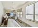Bedroom with beach view, ceiling fans, and natural light at 30 Gulf Blvd, Indian Rocks Beach, FL 33785