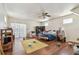 Bright bedroom featuring hardwood floors, a ceiling fan, and natural light from the window at 30 Gulf Blvd, Indian Rocks Beach, FL 33785