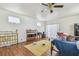 Bedroom featuring hardwood floors, a ceiling fan, and plenty of natural light at 30 Gulf Blvd, Indian Rocks Beach, FL 33785
