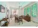 Spacious dining room featuring vintage-style windows and ample seating space at 30 Gulf Blvd, Indian Rocks Beach, FL 33785
