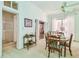 Charming dining room with classic furniture and a view into another room at 30 Gulf Blvd, Indian Rocks Beach, FL 33785