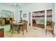 Cozy dining room with round table and views into the living room at 30 Gulf Blvd, Indian Rocks Beach, FL 33785