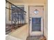 Exterior door with security gate with concrete steps at 30 Gulf Blvd, Indian Rocks Beach, FL 33785