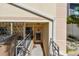 Exterior entrance featuring a metal door and stairs at 30 Gulf Blvd, Indian Rocks Beach, FL 33785
