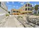 Three-story home on a sandy beach, featuring large windows and adjacent buildings at 30 Gulf Blvd, Indian Rocks Beach, FL 33785