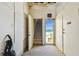 Bright hallway with white walls and carpet, featuring a view of the beach at 30 Gulf Blvd, Indian Rocks Beach, FL 33785