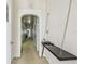 Hallway with carpeted floor, arched doorways and a unique chained table attached to the wall at 30 Gulf Blvd, Indian Rocks Beach, FL 33785
