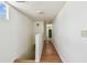 Hallway with white walls and wood floors, leading to another room at 30 Gulf Blvd, Indian Rocks Beach, FL 33785