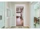 Inviting hallway entrance showcasing hardwood floors, leading to an open and airy living space at 30 Gulf Blvd, Indian Rocks Beach, FL 33785