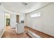 Kitchen with wood floors, white walls, and appliances at 30 Gulf Blvd, Indian Rocks Beach, FL 33785