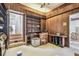 Living room with dark wood panelling and built-in bookshelves at 30 Gulf Blvd, Indian Rocks Beach, FL 33785