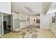 Bright living room with peeling paint and bare concrete at 30 Gulf Blvd, Indian Rocks Beach, FL 33785