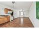 Spacious living area with wood floors and natural light, perfect for gatherings and relaxation at 30 Gulf Blvd, Indian Rocks Beach, FL 33785