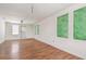 Spacious living area with wood floors and unique windows, providing plenty of natural light at 30 Gulf Blvd, Indian Rocks Beach, FL 33785