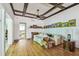 Bright living room with hardwood floors, detailed ceiling and an open doorway to the kitchen at 30 Gulf Blvd, Indian Rocks Beach, FL 33785