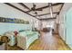 Bright living room featuring hardwood floors, coffered ceiling, fireplace and comfortable couches at 30 Gulf Blvd, Indian Rocks Beach, FL 33785