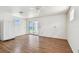 Bright living room with wood floors and sliding glass doors to an ocean view at 30 Gulf Blvd, Indian Rocks Beach, FL 33785