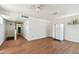 Spacious living room featuring wood floors and a ceiling fan at 30 Gulf Blvd, Indian Rocks Beach, FL 33785