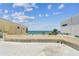 Rooftop with ocean view, palm trees and surrounding building at 30 Gulf Blvd, Indian Rocks Beach, FL 33785