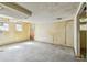 Shows an unfinished room with exposed beams and outdated wood paneling at 30 Gulf Blvd, Indian Rocks Beach, FL 33785