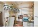 Spacious storage room featuring built-in shelving and hanging racks for maximum organization and clutter reduction at 30 Gulf Blvd, Indian Rocks Beach, FL 33785