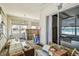 Sunroom with sliding glass doors offering ocean views, featuring ample natural light at 30 Gulf Blvd, Indian Rocks Beach, FL 33785