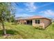 The backyard offers a well-maintained lawn and ample space for outdoor enjoyment at 3060 Mountain Spruce Ter, Wesley Chapel, FL 33543