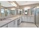 Spacious bathroom featuring double vanities, ample counter space, and sleek modern fixtures at 3060 Mountain Spruce Ter, Wesley Chapel, FL 33543