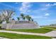 Winding Ridge community entrance sign with flowing water feature on a bright, sunny day at 3060 Mountain Spruce Ter, Wesley Chapel, FL 33543