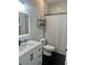 The bathroom features black hexagonal tile floors, a subway tile shower, and a modern vanity at 310 S Willow Ave # A, Tampa, FL 33606