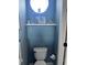 Charming half-bathroom with blue shiplap wall, decorative art, and modern fixtures for a touch of whimsy at 310 S Willow Ave # A, Tampa, FL 33606