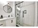 Stylish bathroom featuring a glass-enclosed shower and a modern vanity with sleek fixtures at 310 S Willow Ave # A, Tampa, FL 33606