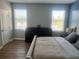 Comfortable bedroom with soft bedding, modern decor, and ample natural light, providing a serene and inviting retreat at 310 S Willow Ave # A, Tampa, FL 33606