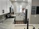 Well-lit kitchen showcasing modern appliances, countertops, and cabinets, creating a functional and stylish cooking space at 310 S Willow Ave # A, Tampa, FL 33606