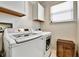 Well-lit laundry room equipped with modern washer and dryer units and ample cabinet storage space at 310 S Willow Ave # A, Tampa, FL 33606