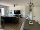 Open-concept living room features modern decor, hardwood floors, and abundant natural light, perfect for relaxation at 310 S Willow Ave # A, Tampa, FL 33606