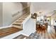 Inviting living room boasts beautiful wood floors, staircase, and an open floorplan flowing to the kitchen at 310 S Willow Ave # A, Tampa, FL 33606