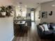 Open-concept living space with a view of the dining area and modern kitchen at 310 S Willow Ave # A, Tampa, FL 33606