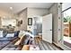 Open living room with comfortable seating, access to a half bathroom, and outdoor views at 310 S Willow Ave # A, Tampa, FL 33606