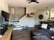 Open-concept living area featuring a cozy sofa, staircase, and hardwood floors at 310 S Willow Ave # A, Tampa, FL 33606